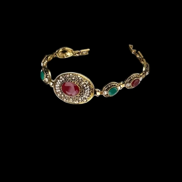 Gold Bracelet with Red and Green Accents Faux Gemstones - Picture 1 of 4